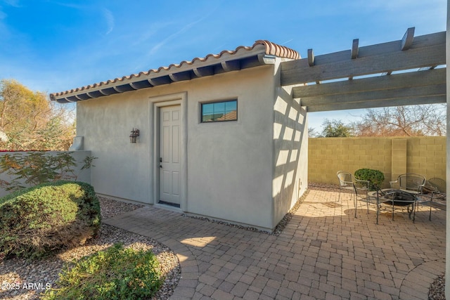 891 W Palo Brea Dr, Litchfield Park, AZ 85340 - view of outbuilding featuring a fire pit, fence, and a pergola