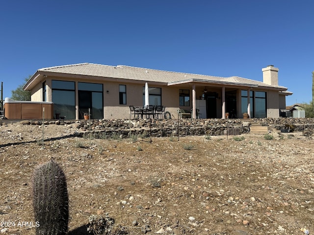 back of property with a patio area