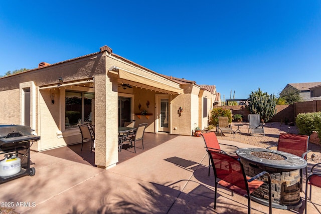 view of patio / terrace with a fire pit and grilling area