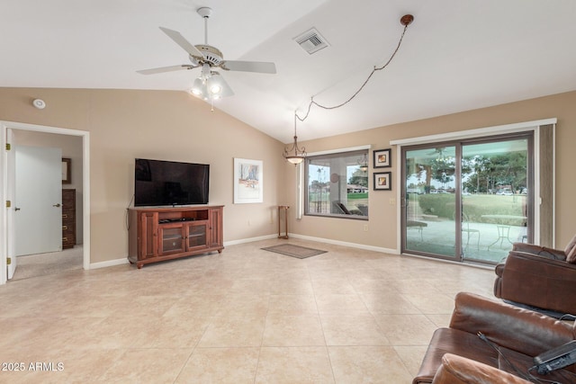 tiled living room featuring ceiling fan and lofted ceiling