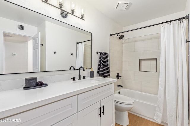 7432 N 43rd Ln, Glendale, AZ 85301 - bathroom with vanity, wood finished floors, and shower / bath combination with curtain