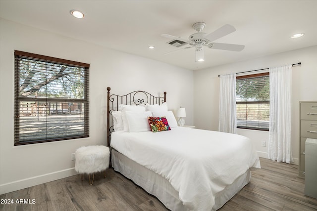 bedroom featuring light wood-type flooring and ceiling fan