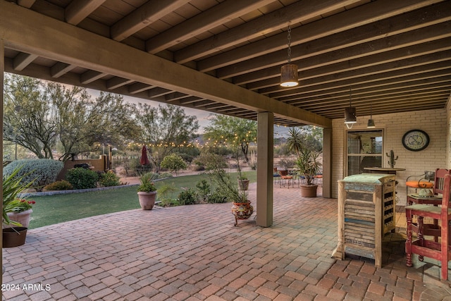 view of patio terrace at dusk