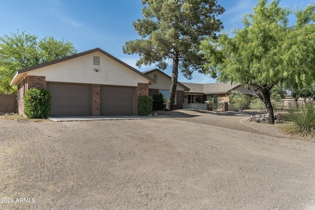 ranch-style home with a garage