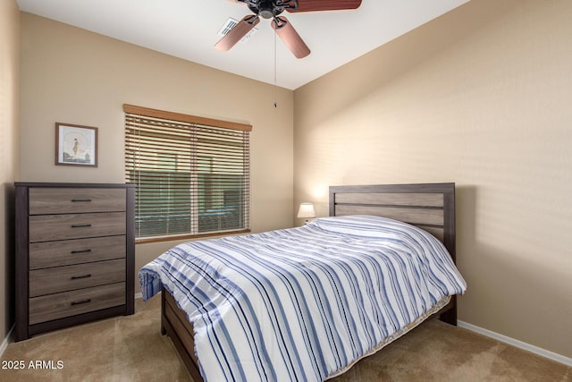 bedroom featuring a ceiling fan, visible vents, baseboards, and carpet flooring