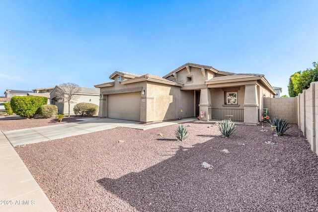 ranch-style house with driveway, an attached garage, fence, and stucco siding