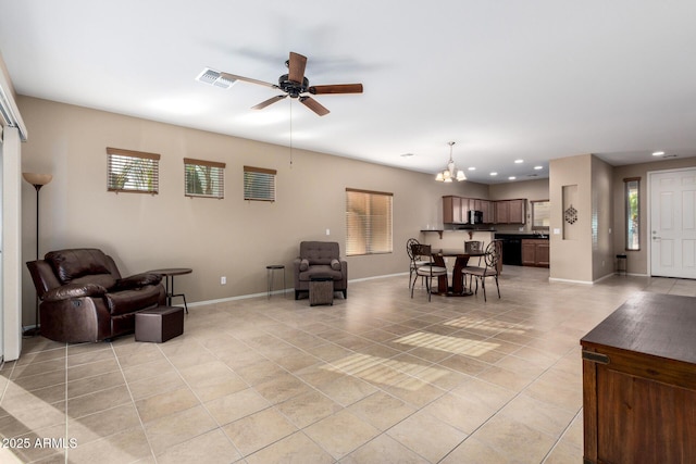 living area with light tile patterned floors, baseboards, visible vents, and recessed lighting