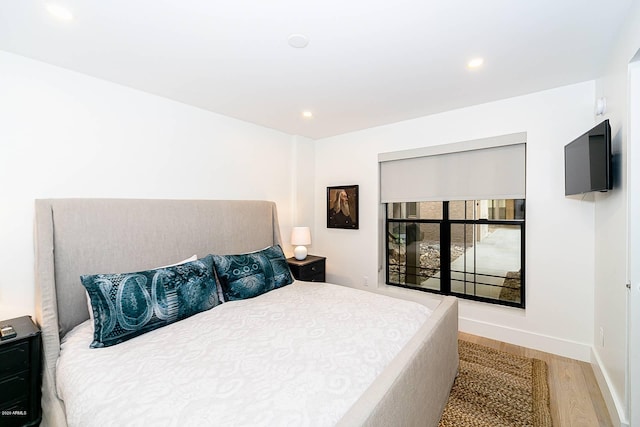 bedroom featuring recessed lighting, baseboards, and wood finished floors