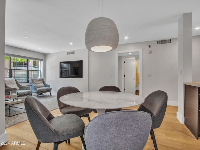 dining room featuring light hardwood / wood-style floors