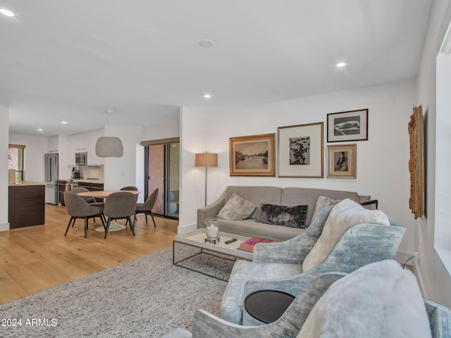 living room featuring recessed lighting and light wood finished floors