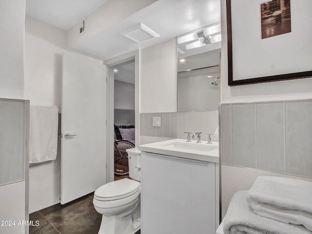 bathroom with vanity, toilet, and tile patterned flooring