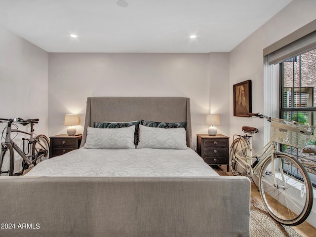 bedroom featuring wood finished floors and recessed lighting