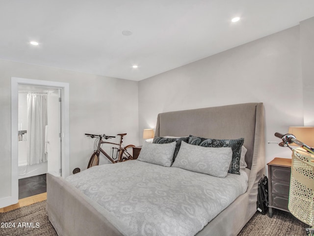 bedroom featuring wood finished floors and recessed lighting