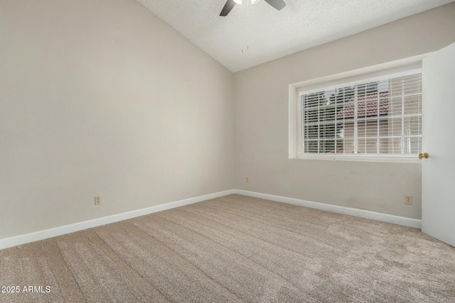 unfurnished room with carpet flooring, a ceiling fan, baseboards, and a textured ceiling