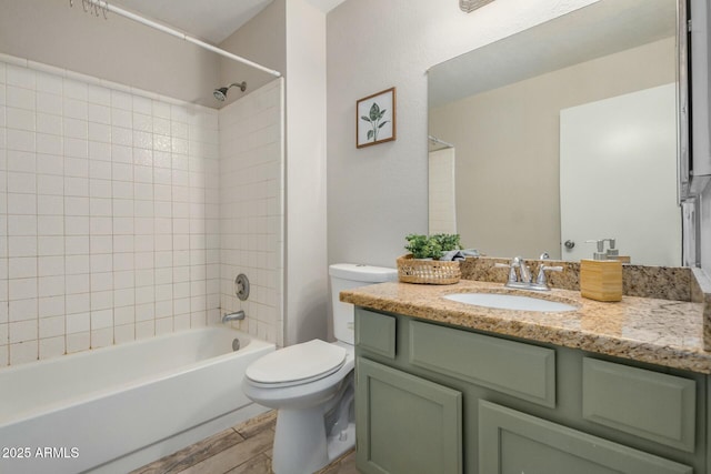 full bath featuring tub / shower combination, toilet, vanity, and wood tiled floor