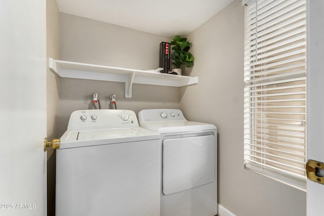 laundry room featuring washer and clothes dryer and laundry area