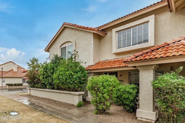 view of front of house featuring stucco siding