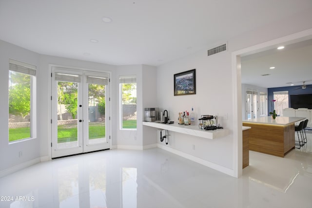 doorway to outside with sink and french doors