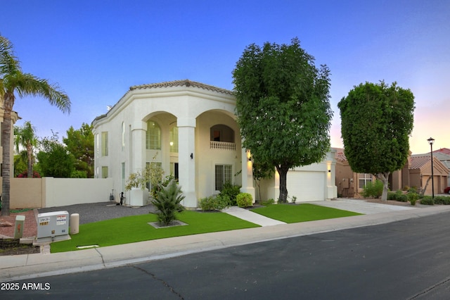 view of front facade with a garage and a yard