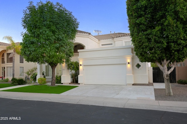 mediterranean / spanish house with a garage