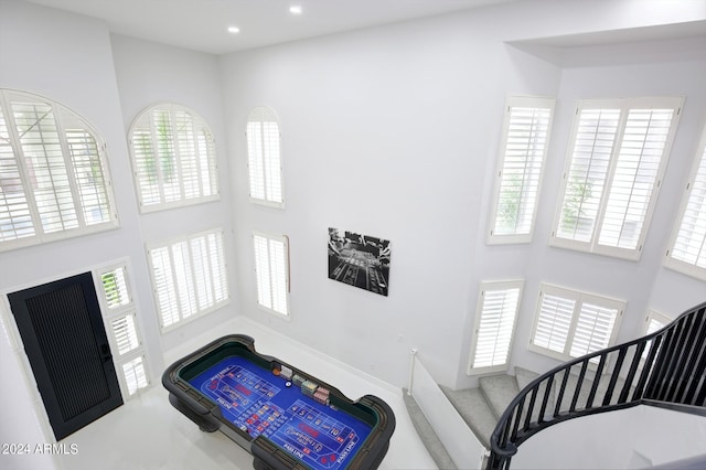 interior space featuring a towering ceiling