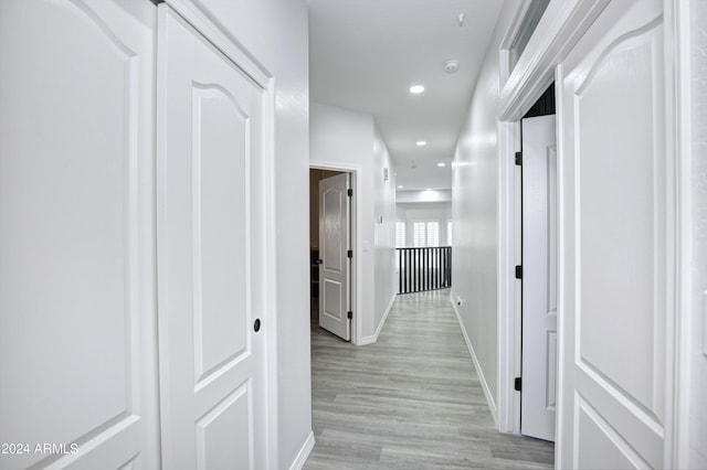 corridor featuring light hardwood / wood-style floors