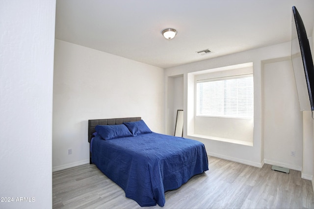 bedroom with light hardwood / wood-style flooring