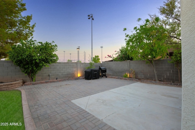 view of patio terrace at dusk