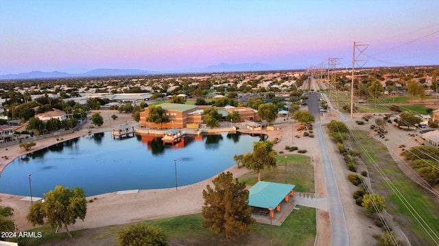 aerial view at dusk with a water and mountain view