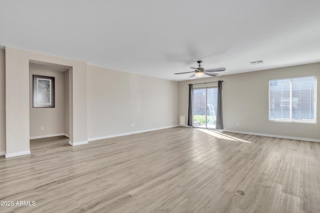 unfurnished room with visible vents, baseboards, and light wood finished floors