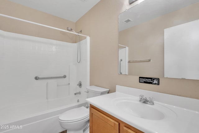 bathroom featuring visible vents, toilet, vanity, and washtub / shower combination