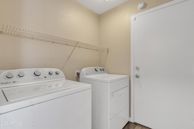 laundry room with separate washer and dryer and laundry area