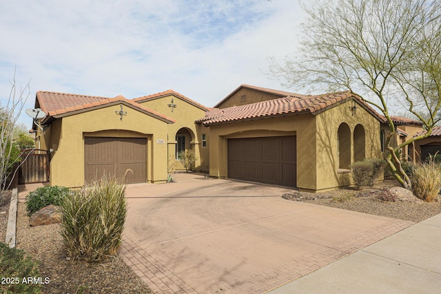 mediterranean / spanish home featuring a garage