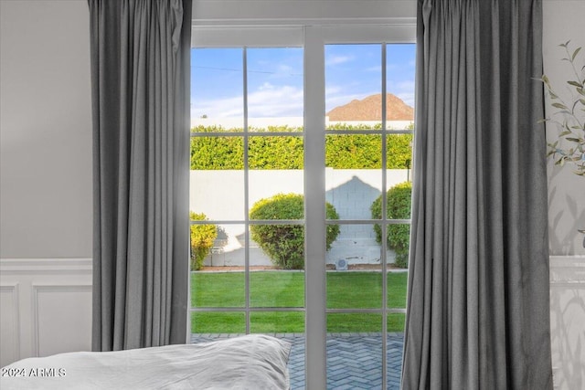 bedroom featuring a mountain view