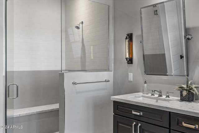 bathroom featuring vanity and walk in shower