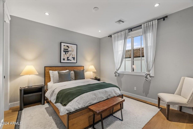 bedroom with light hardwood / wood-style flooring