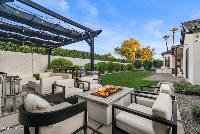 view of patio with an outdoor kitchen, an outdoor living space with a fire pit, and a pergola