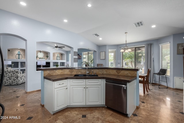 kitchen with sink, dishwasher, an island with sink, decorative light fixtures, and white cabinets