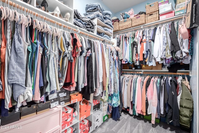 walk in closet featuring carpet floors