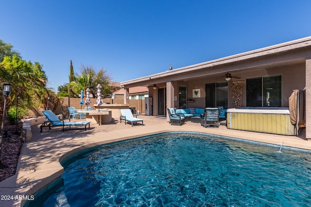 view of pool featuring a patio, an outdoor living space, and ceiling fan