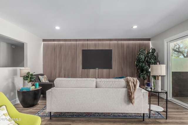 living area with recessed lighting and wood finished floors
