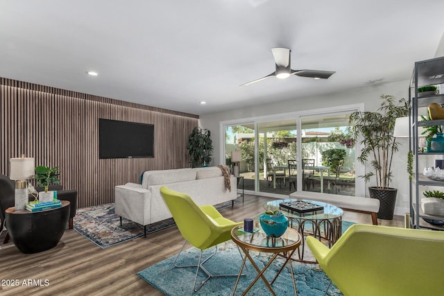 living room with a ceiling fan, wood finished floors, and recessed lighting