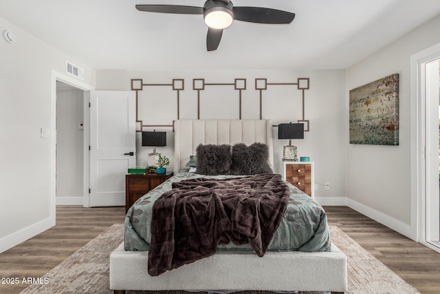 bedroom with wood finished floors, baseboards, and ceiling fan