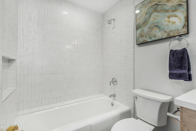 bathroom with toilet, bathing tub / shower combination, and vanity