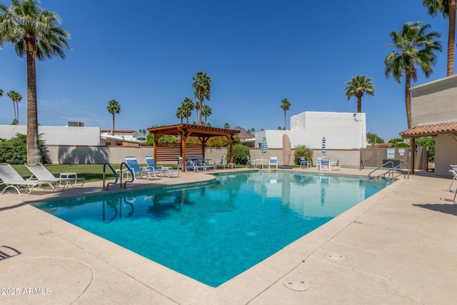 community pool featuring a patio area, fence, and a gazebo