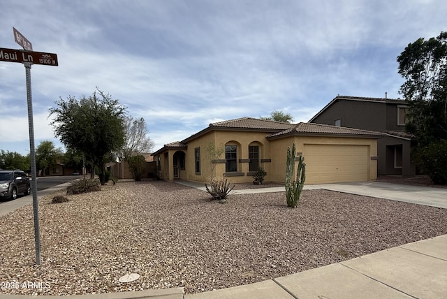 16159 W Maui Ln, Surprise, AZ 85379 - mediterranean / spanish home with concrete driveway, stucco siding, an attached garage, and a tile roof
