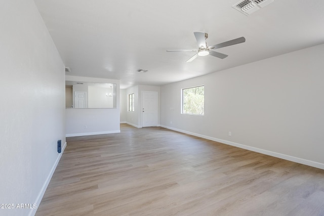 16159 W Maui Ln, Surprise, AZ 85379 - empty room featuring ceiling fan, baseboards, and light wood finished floors