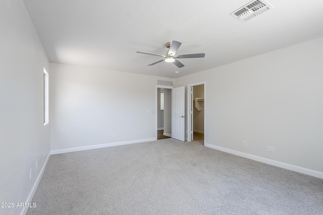 16159 W Maui Ln, Surprise, AZ 85379 - unfurnished bedroom with carpet floors, baseboards, a spacious closet, and ceiling fan