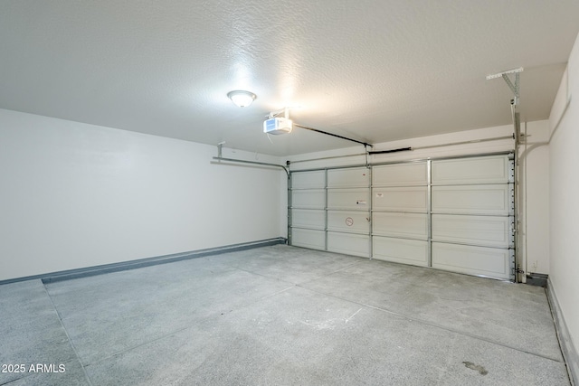 16159 W Maui Ln, Surprise, AZ 85379 - garage featuring a garage door opener and baseboards