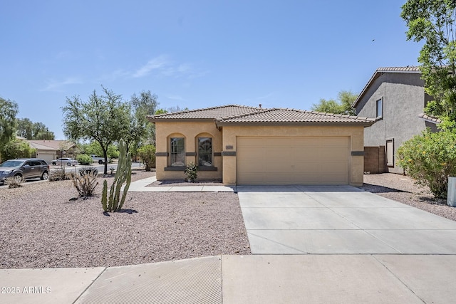 16159 W Maui Ln, Surprise, AZ 85379 - mediterranean / spanish-style house featuring a tiled roof, stucco siding, and a garage